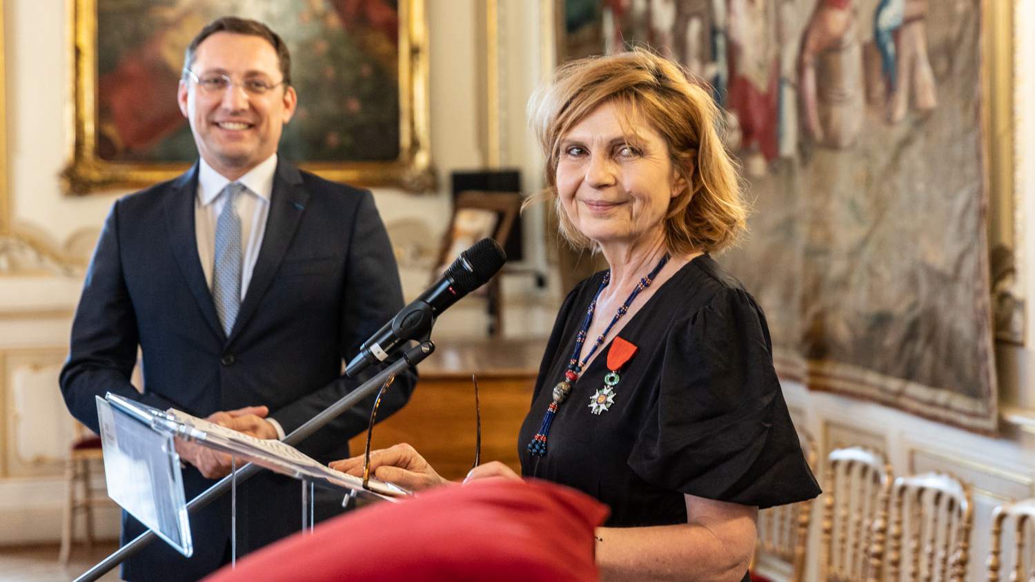 French Ambassador Alexis Duterte and journalist Petra Procházková during the ceremony.